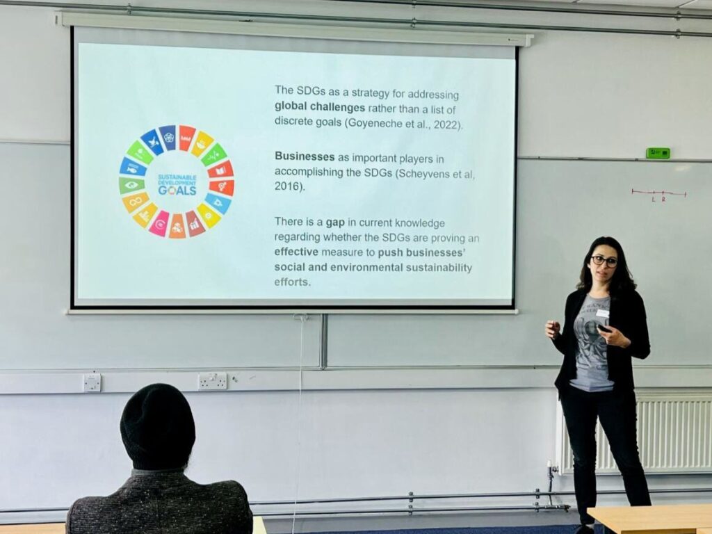 Alessia Patuelli presenting a slide about the UN Sustainable Development Goals.